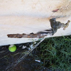 Leaking tap with attempted fix using timber stake