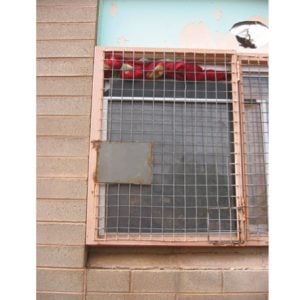 Broken window with blanket in top of window to exclude cold winds in winter