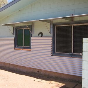 New shade wall and awning (hot/ dry climate). Shade walls added to a house to reduce indoor temperatures in summer